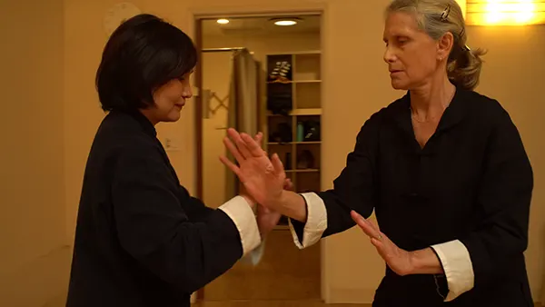 two-women-doing-tai-chi-push-hands