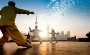 people-practicing-tai-chi-in-morning