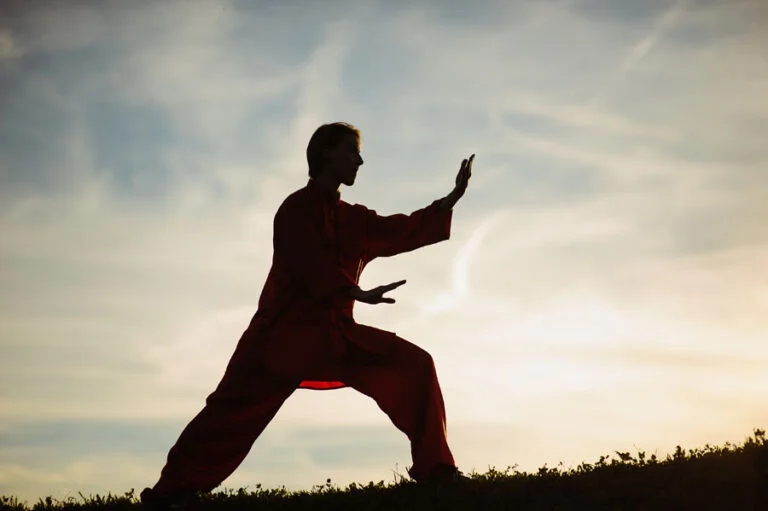 dark-lit-woman-doing-tai-chi